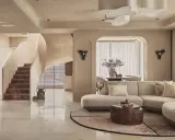 Salón con sofá curvo, mesa de centro de tronco y escaleras de mármol. Un espacio con estilo vanguardista y acabados orgánicos.