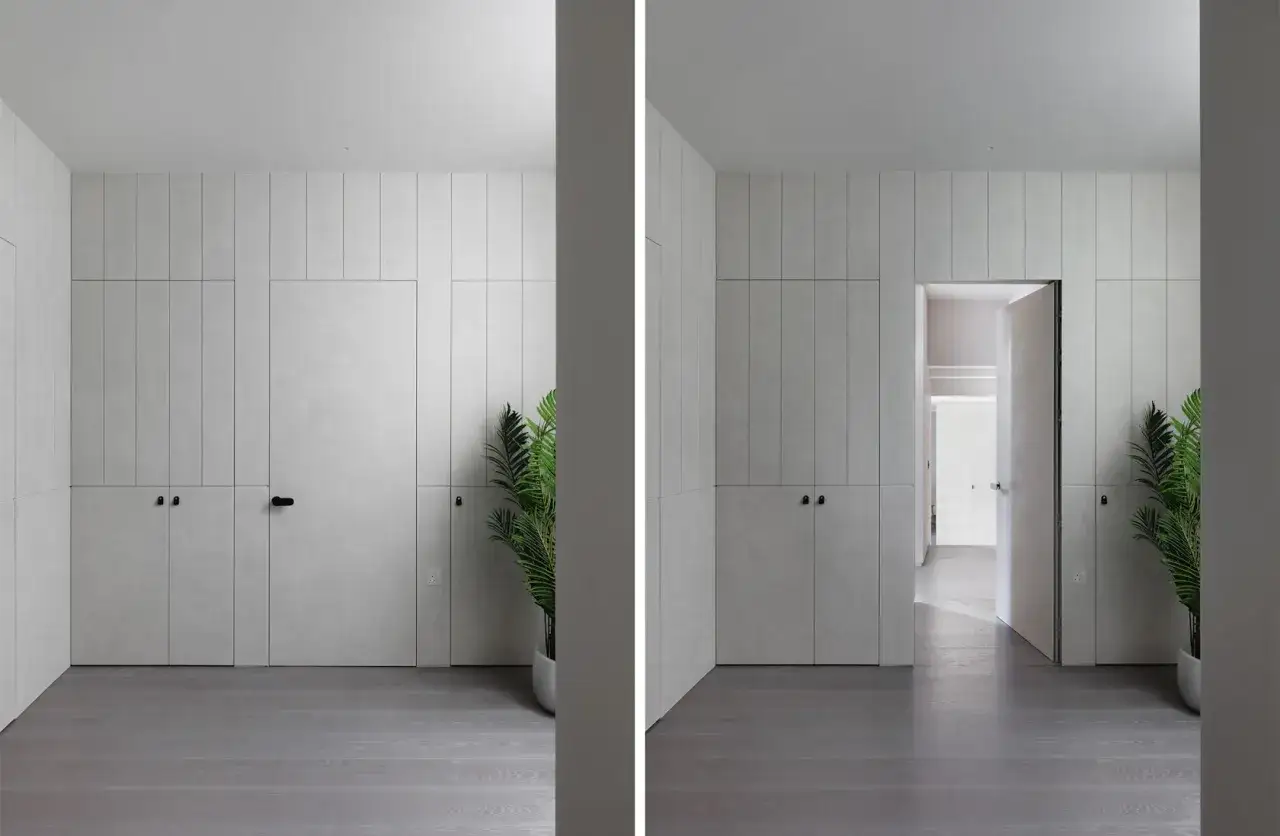 Un ejemplo de cómo ocultar una puerta en una pared, integrándola con el diseño de armarios y paneles.
