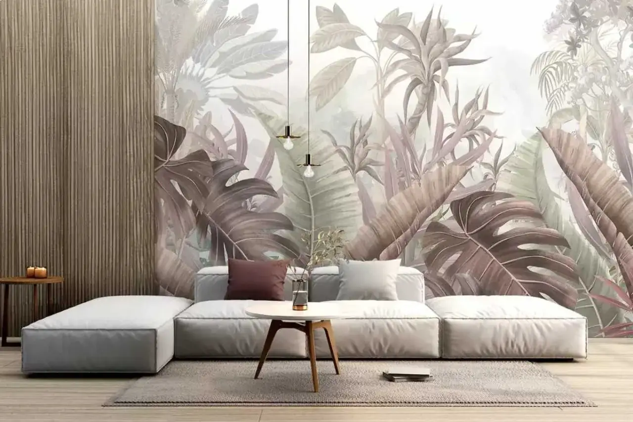Sofá moderno frente a pared con mural botánico, ideales para crear ambientes originales pintar paredes con efectos.